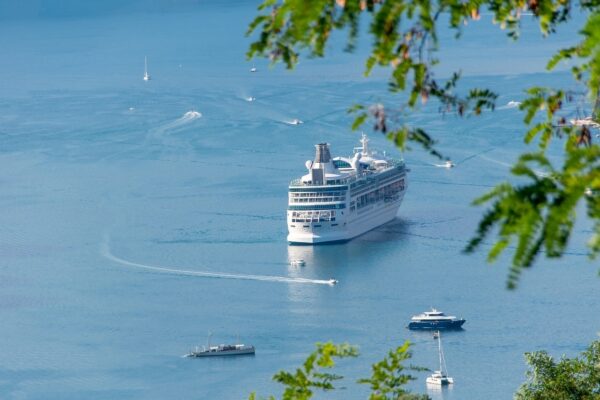 How to pack for a cruise holiday. Cruise ship on open water.